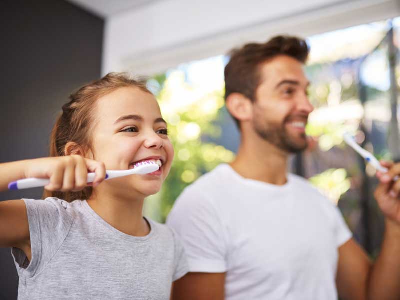 Happy Father Daughter Tooth Brushing