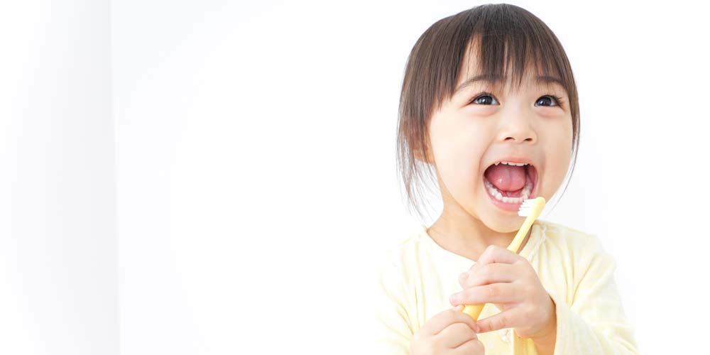 child brushing with dental sealants