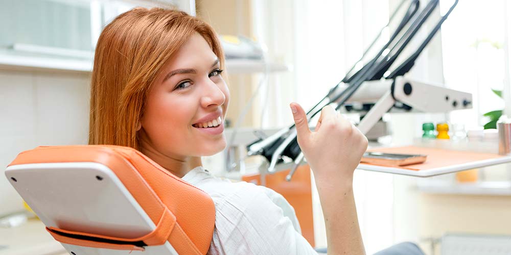 dental patient with thumbs up for laughing gas